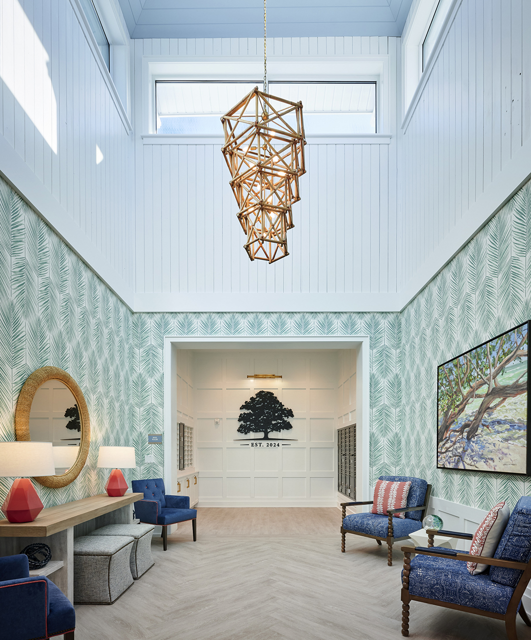 Satellite campus upscale, two-story lobby with striking light fixture and green pattern wallpaper