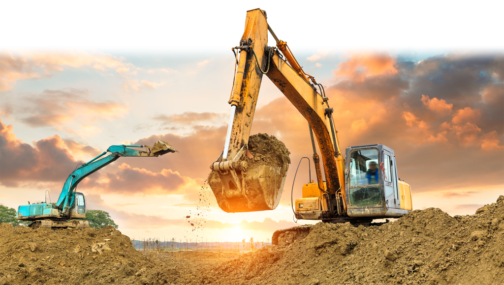 Two backhoes digging in the dirt with a sunset behind them
