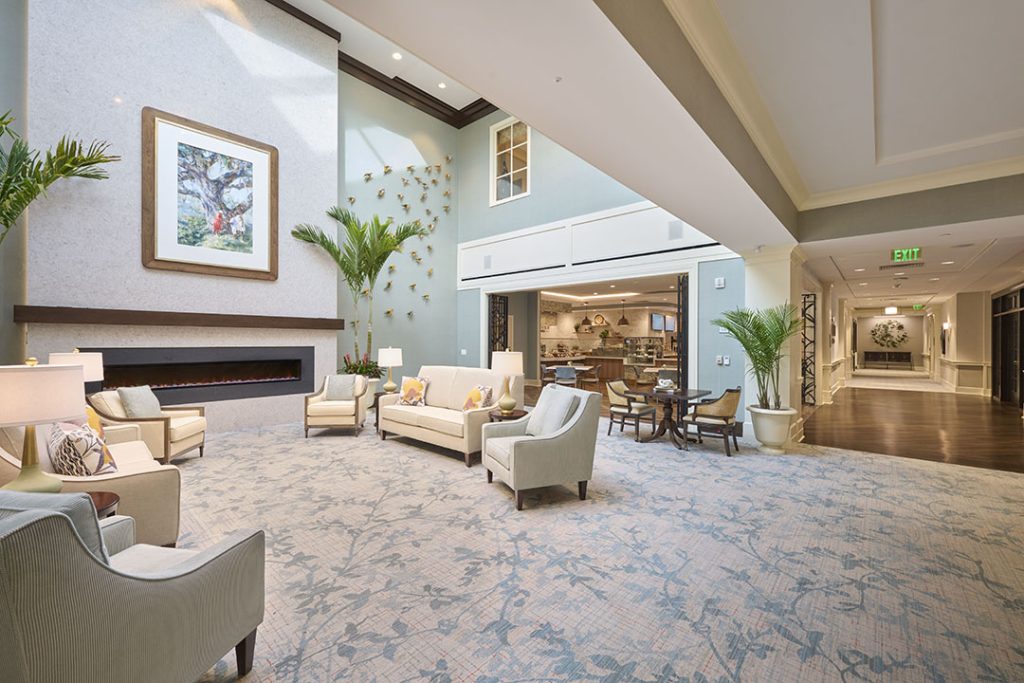 The light-filled atrium features a two-story library and sitting area with a contemporary fireplace and large skylight. A locally-commissioned painting and glass sculptures celebrate the guiding design themes.