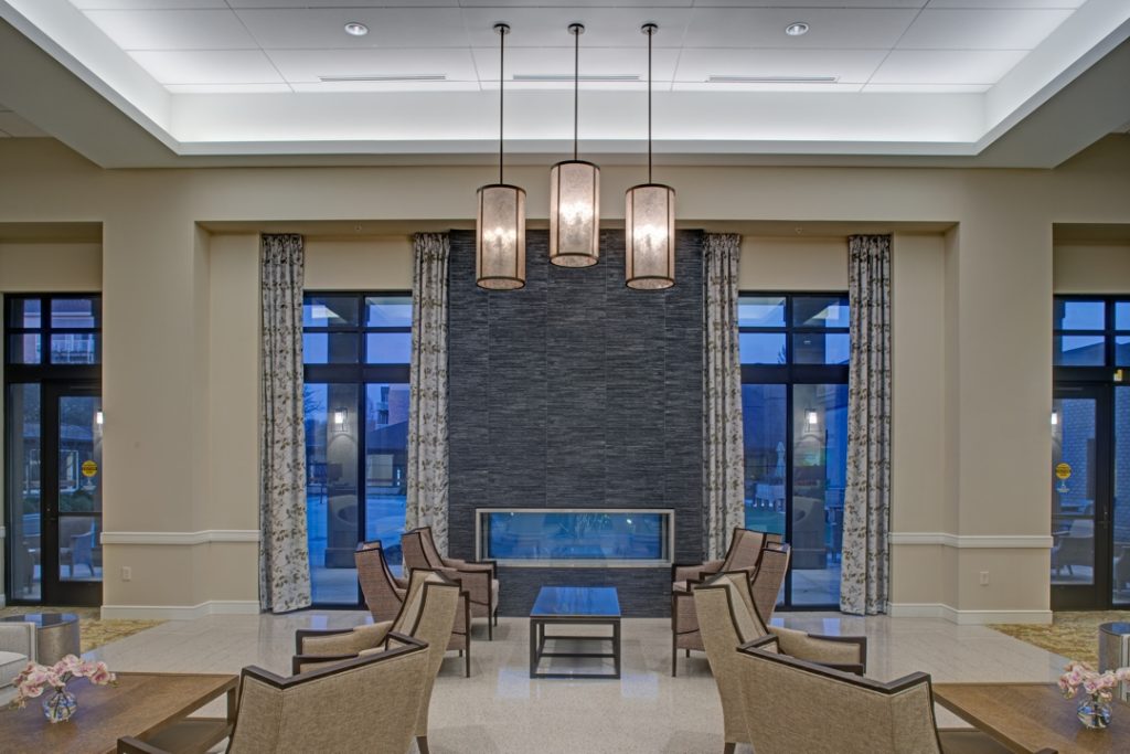 The two-sided fireplace is an appealing new feature for both the interior lobby and the exterior courtyard.