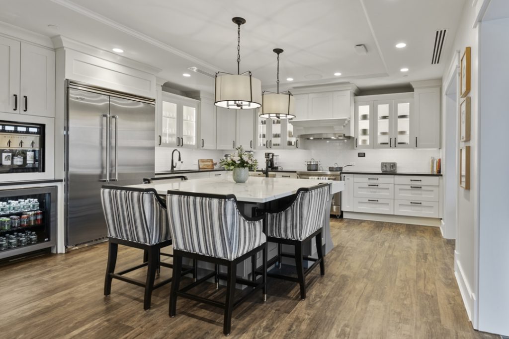 White kitchen with center island and wine fridge