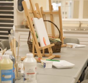 Tabletop easel set up for a class with paints