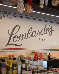 A custom tile sign inside a modern delicatessen