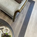 Close-up of varied LVT flooring colors used on the floor in a sales center