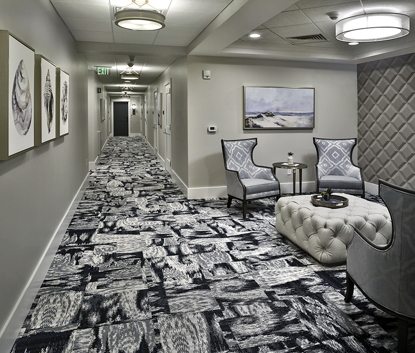 Corridor with lounge sitting area