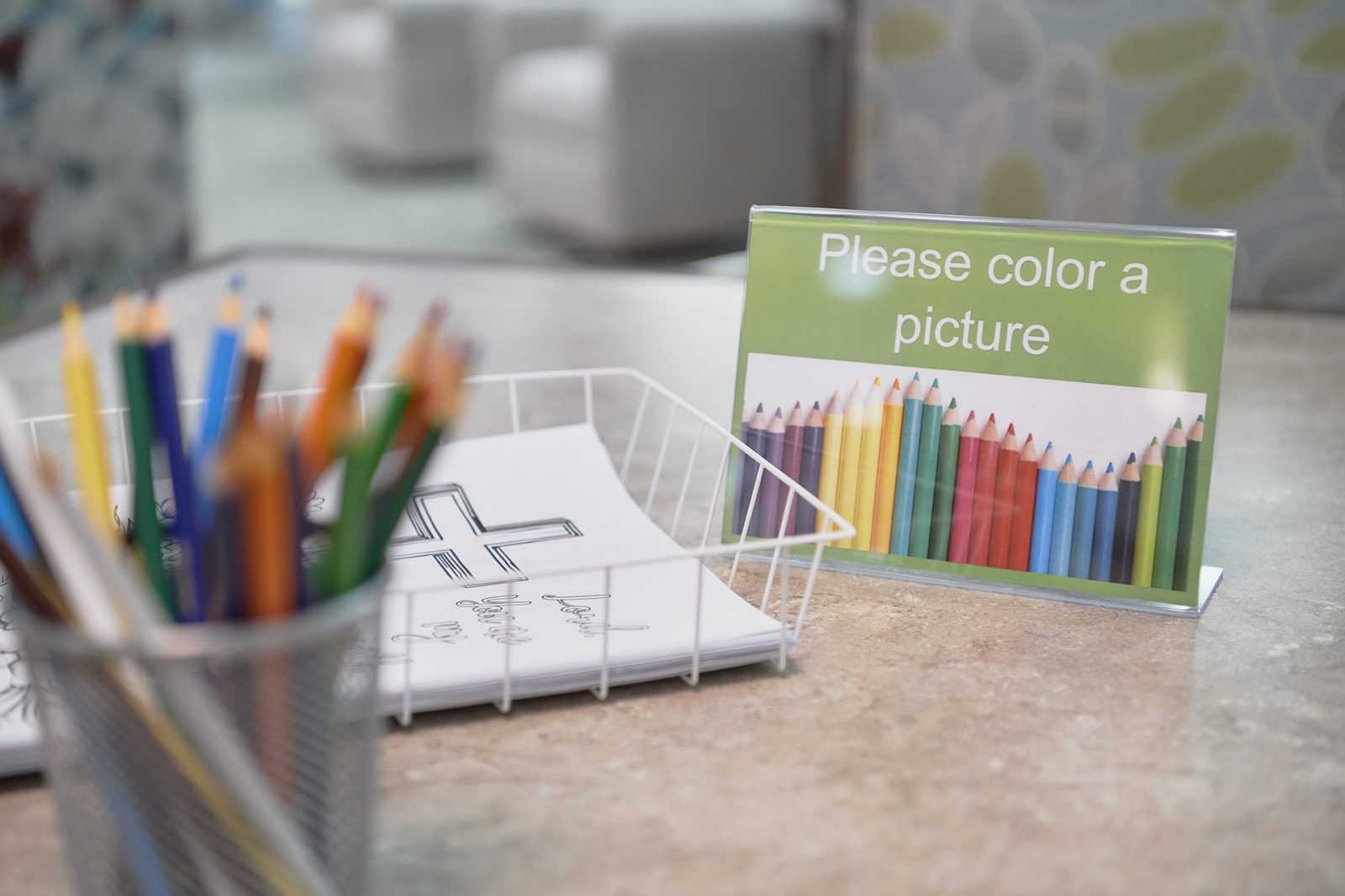 Closeup of sign and supplies encouraging residents to color a picture