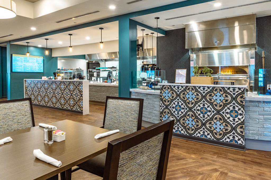 Cafe display kitchen with vibrant pattern tile counter accent
